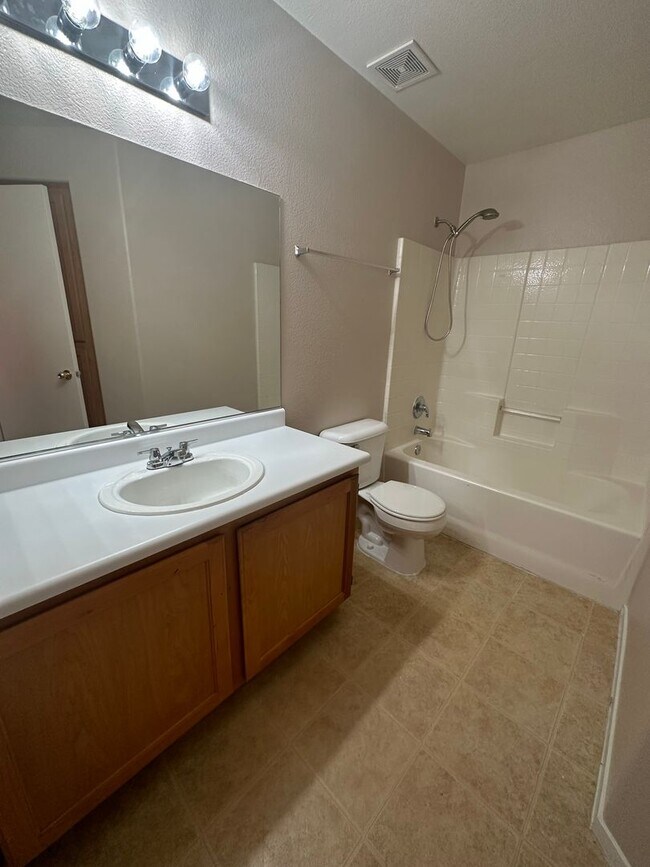 Building Photo - Cozy Condo with fireplace in living room.