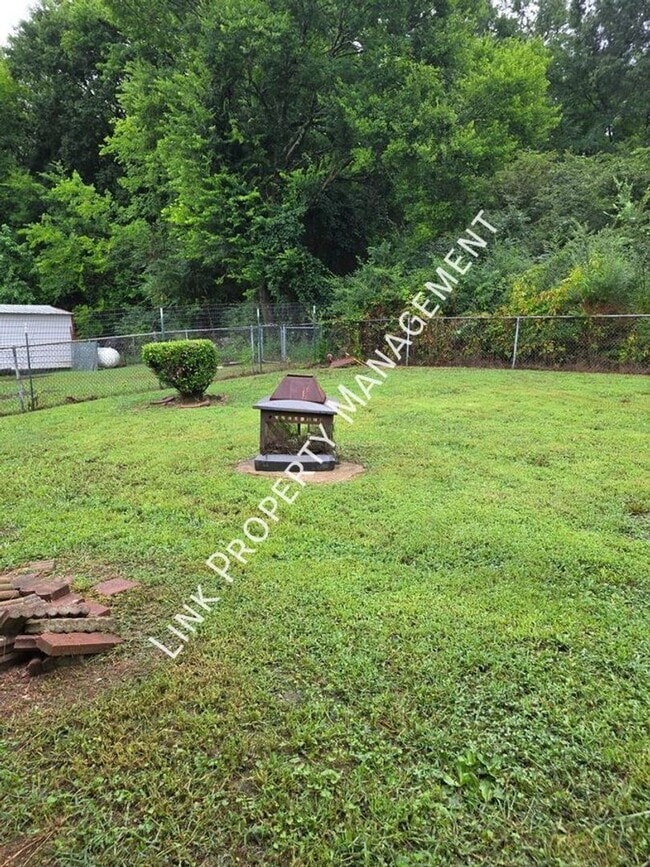 Building Photo - COMING SOON July 24th!  Don't miss this 3 Bedroom 1.5 Baths with Garage, Fenced Backyard, Den and...