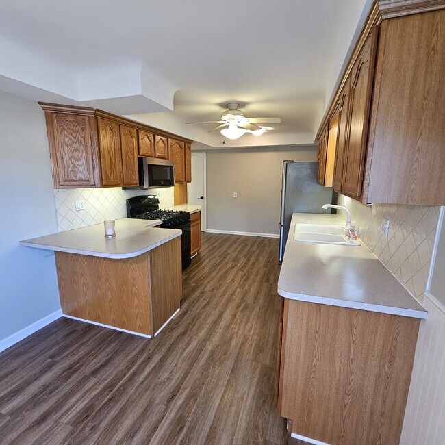 Building Photo - 3 Bedroom, 1.5 Bath Brick Ranch. Huge Great Room and Living Room. Big Kitchen, Backyard with Deck...