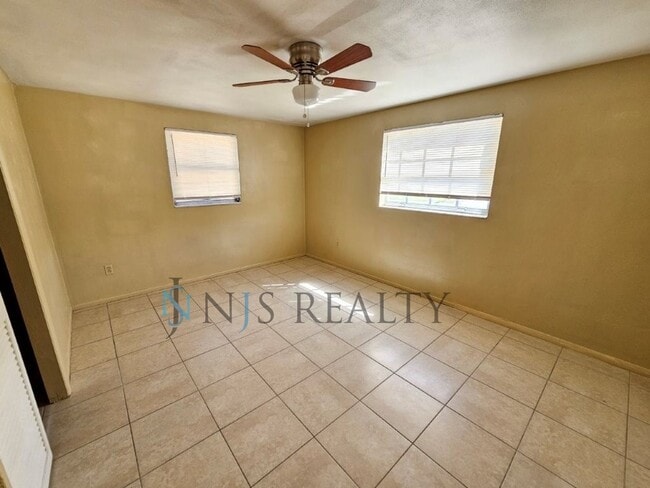 Building Photo - JUST REDUCED!!! True 2/1.5/1 with FIREPLACE, fenced yard and all tile flooring throughout!