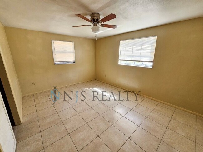 Building Photo - True 2/1.5/1 with FIREPLACE, fenced yard and all tile flooring throughout!