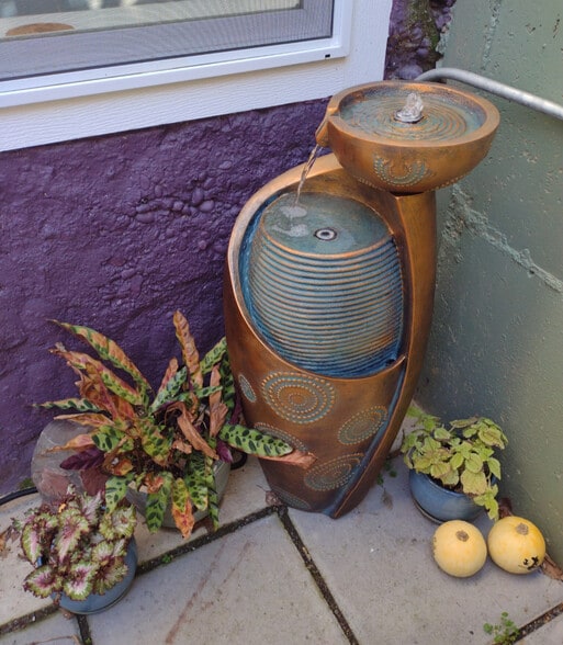 Once the frost has passed, enjoy the plants and soft bubbling fountain in your private patio - 4157 SE Brooklyn St