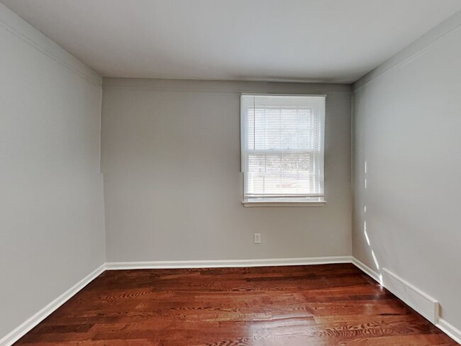 Building Photo - Spacious 4BR Home with Finished Basement, Fireplace & Unique Layout