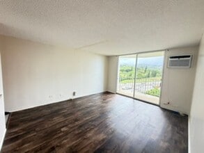 Building Photo - Welcome to your new home at Pearlridge Gardens & Tower! This 1-bedroom, 1-bathroom condo $2,100