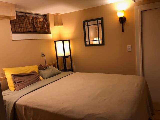 Cozy bedroom has small dresser, secretary desk, and two night tables - 2 Emmons Pl