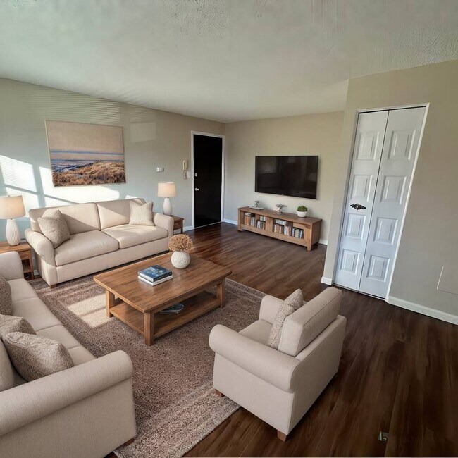 Relax in this elegantly designed living room, perfect for comfort and style. - Country Club