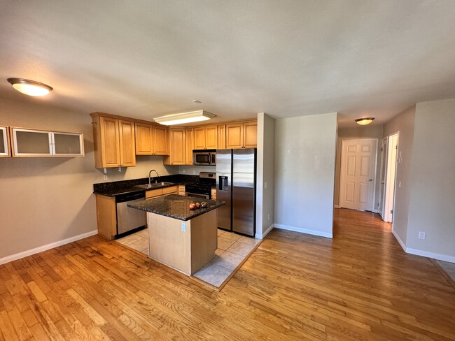 Kitchen w/ new refrigerator - 1027 Newport Ave