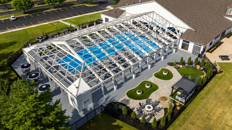 Indulge in year-round swimming at The LINC, featuring a unique indoor-outdoor pool surrounded by stylish lounging areas. Enjoy a vibrant community with top-tier amenities designed for your comfort and convenience. - The LINC