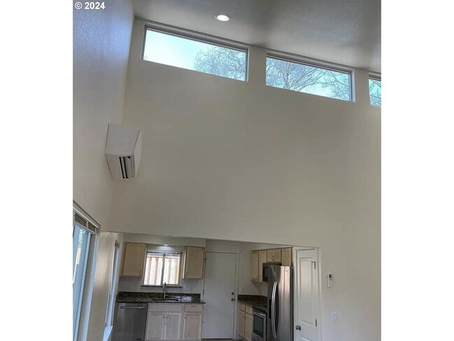 Building Photo - Bright and Airy Home with Stainless Steel Kitchen, Vaulted Ceilings & Washer + Dryer