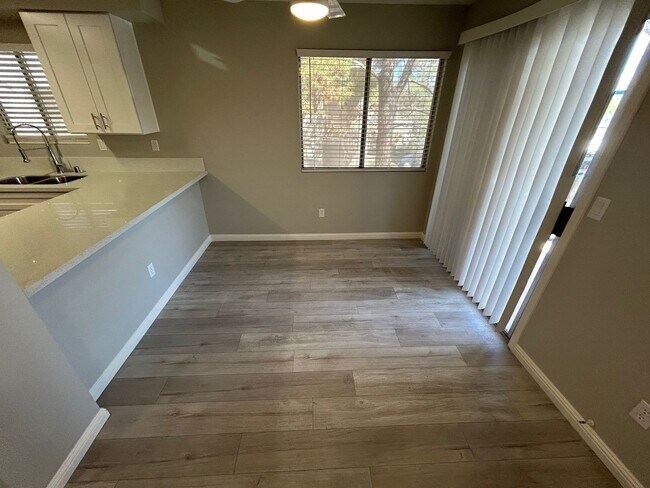 Building Photo - INVITING 2 BEDROOM TOP FLOOR CONDO IN A CE...