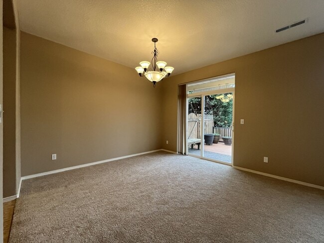 Building Photo - Inviting Two-Story 3BR Home Featuring New Carpet, New Stainless Appliances, Spacious Garage Stora...