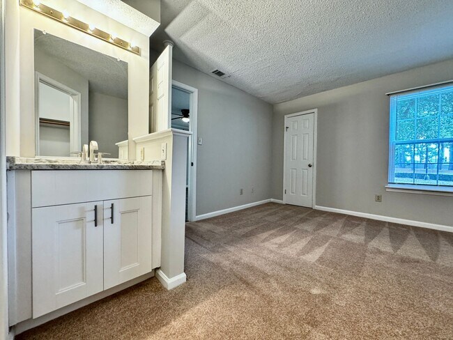 Building Photo - Updated 1st Floor/1-Level Condo Available NOW & Rent Includes Water, Sewer, Trash, Landscaping, F...