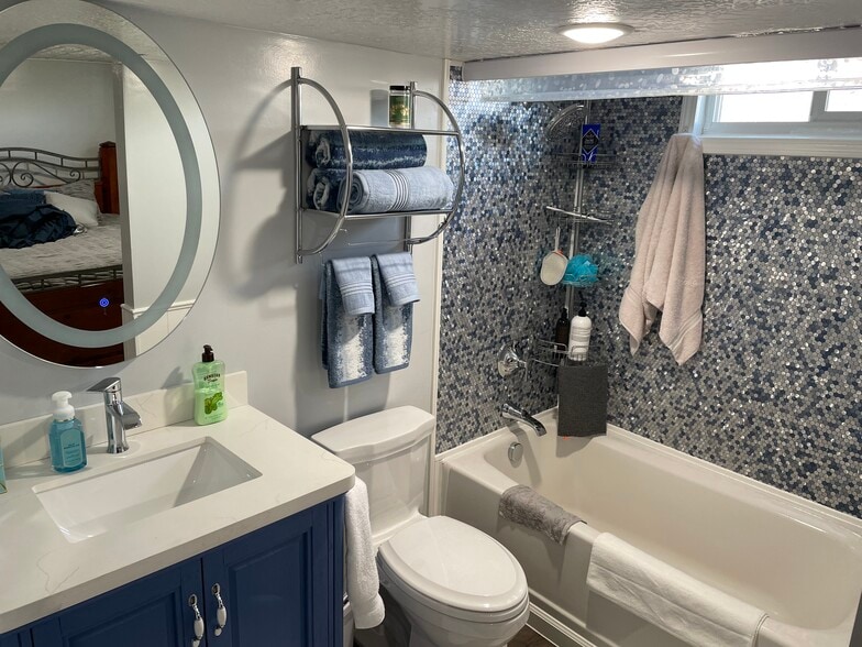Full bathroom with tub and shower - 268 E 9000 S
