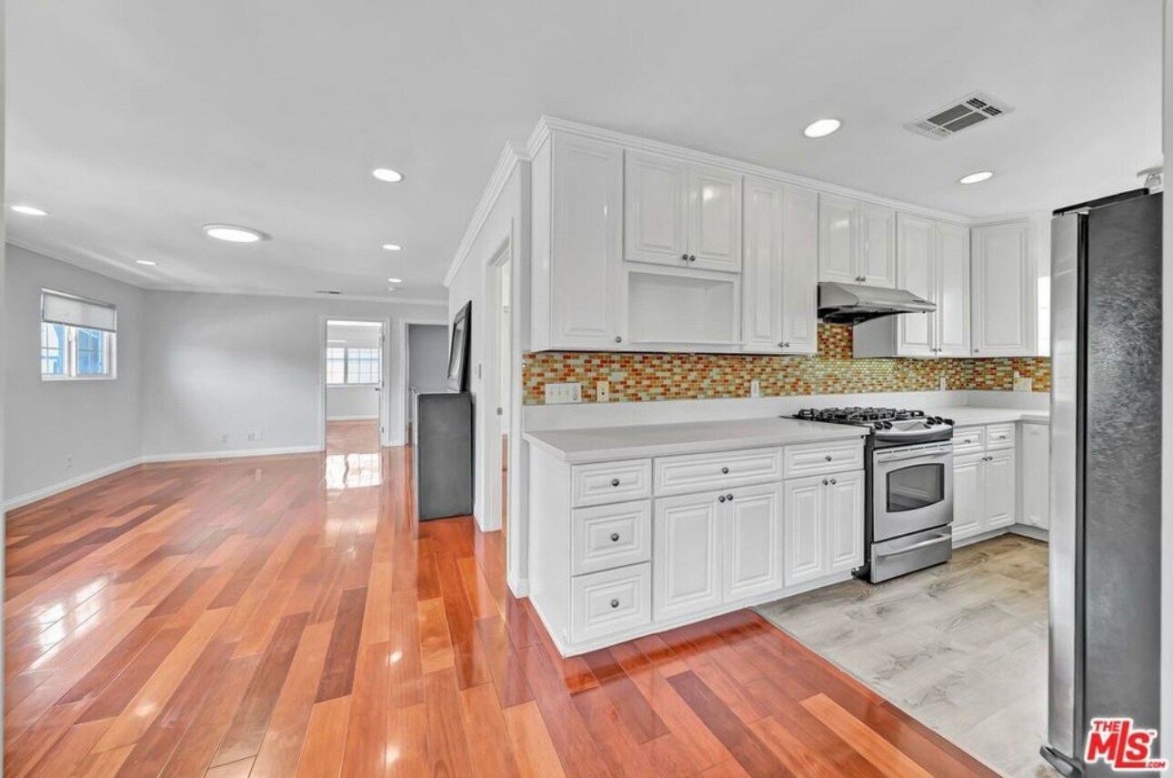 Shared living room. Shared kitchen. - 3242 Hutchison Ave