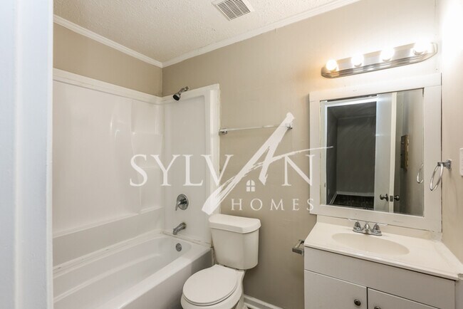 Building Photo - This 4 bedroom, 2 bathroom home is exactly...