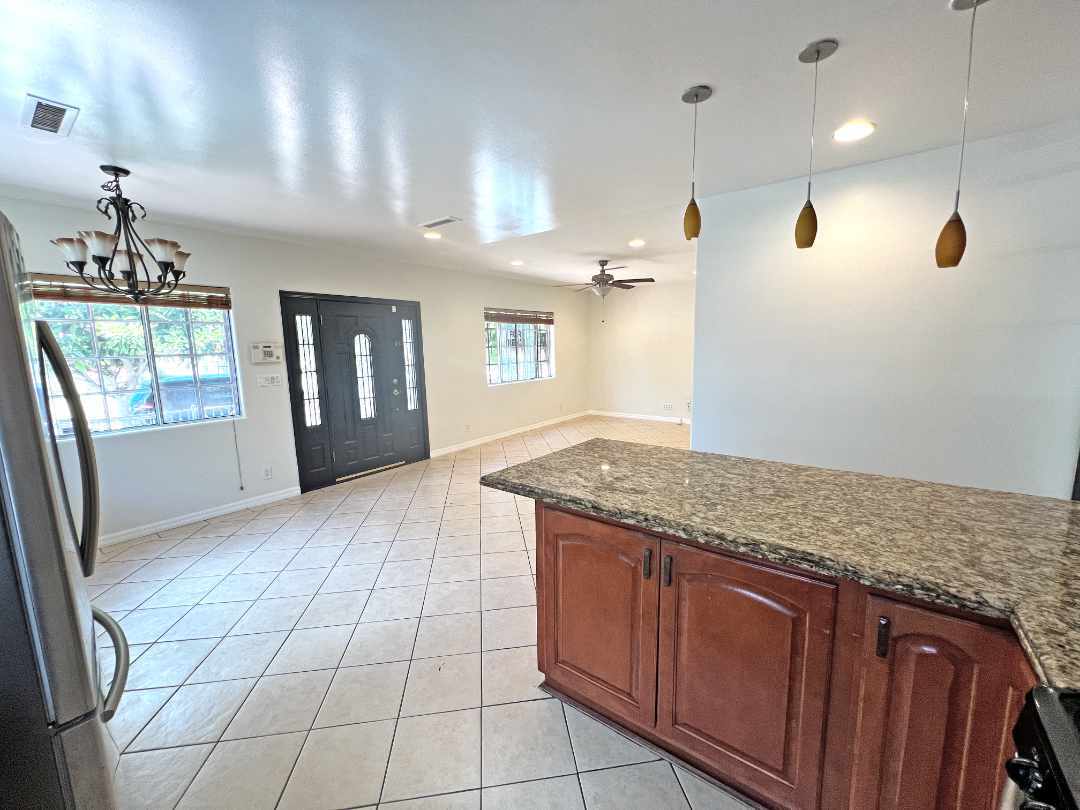 Kitchen (wide-angle) looking back to family room and dining area. - 2330 S Mansfield Ave