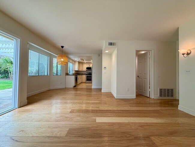Building Photo - Spacious 4 Bedroom House with Large Fenced Yard! Landscaping Included! Two Car Garage!