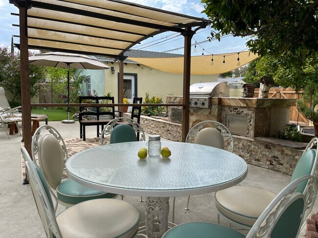 Patio table for 6 w green glass ware - 23437 Vanowen St