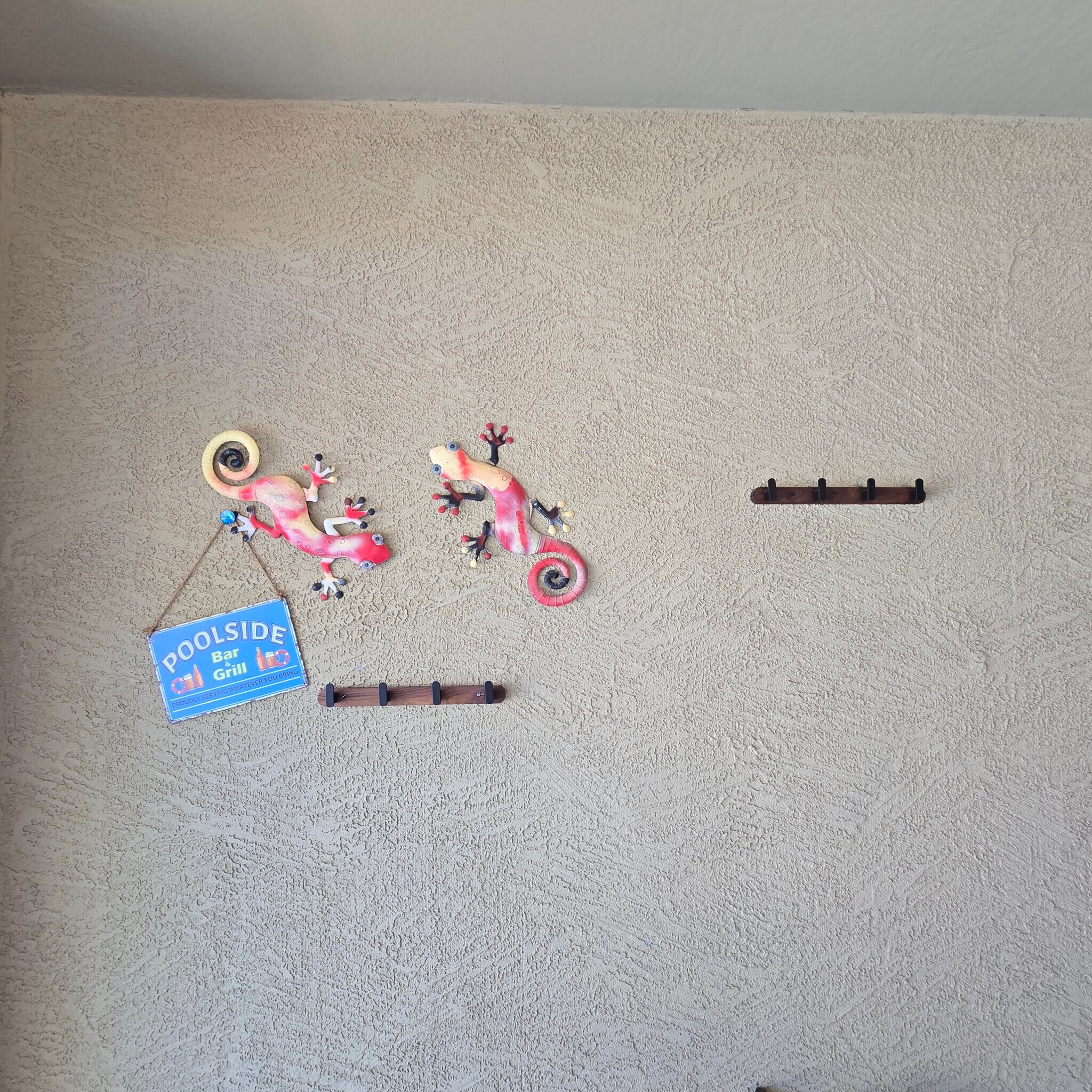 Patio wall decor with towel hooks - 280 E Indigo Dr