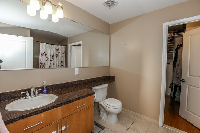 Master bathroom with door leading to master walk in closet - 715 6th St NW