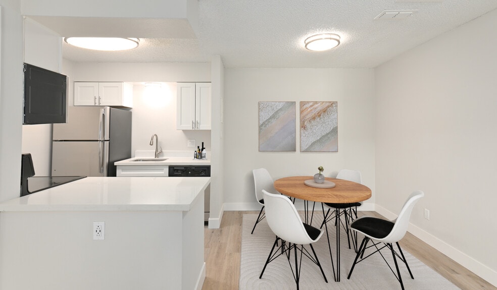 Kitchens features stainless steel appliances and updated cabinetry - Creekside