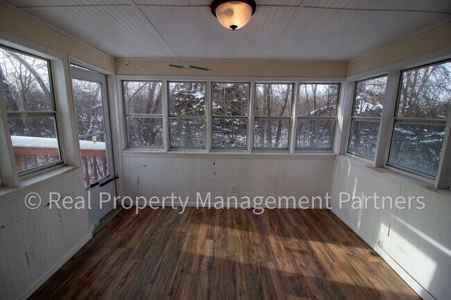 Building Photo - 2-Bed, 1-Bath Upper Unit with Garage & Porch – Steps from Paul Henry Trail