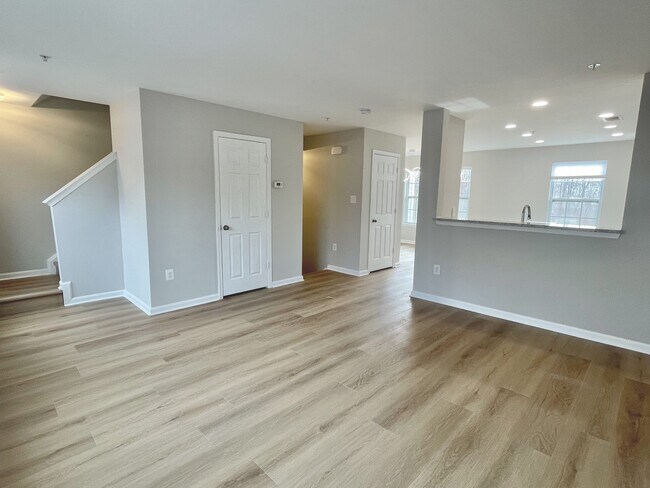 Living room, luxury vinyl plank throughout - 12430 Horseshoe Bend Cir
