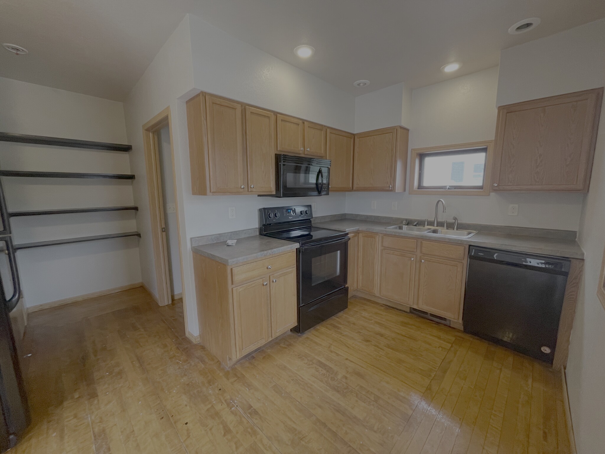 Spacious primary bedroom with natural light and plenty of room for a full bedroom furniture set. - 1016 4th Ave