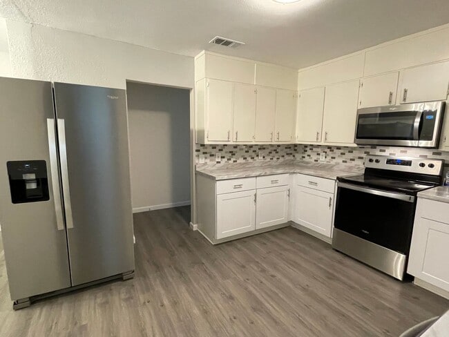 Building Photo - ** Application Received** Available Now! Updated 4BR Home with Large Yard, Storage Shed & Modern ...