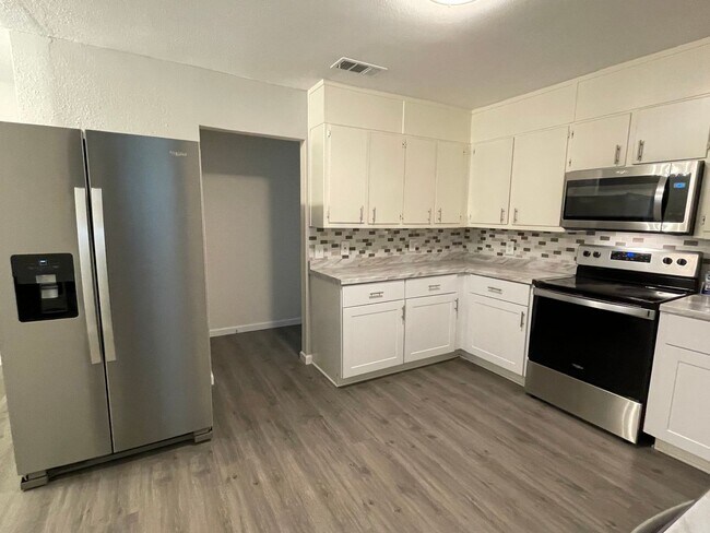 Building Photo - Available Now! Updated 4BR Home with Large Yard, Storage Shed & Modern Finishes