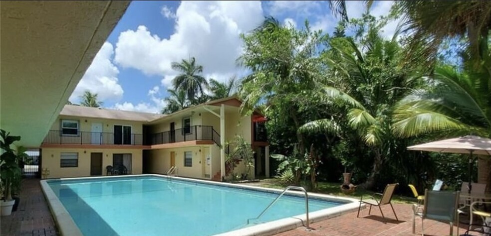 View from unit unit entrance door looking out at the pool. - 1826 N Dixie Hwy