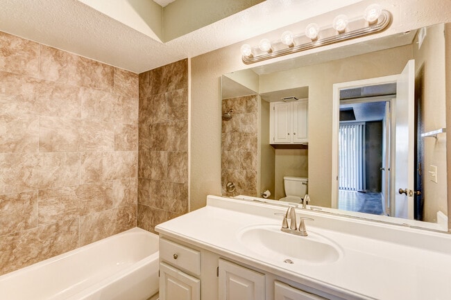 Building Photo - Cozy 1-Bedroom Condo with Modern Amenities...