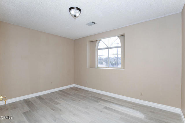 Building Photo - 3831 E Ave T 8