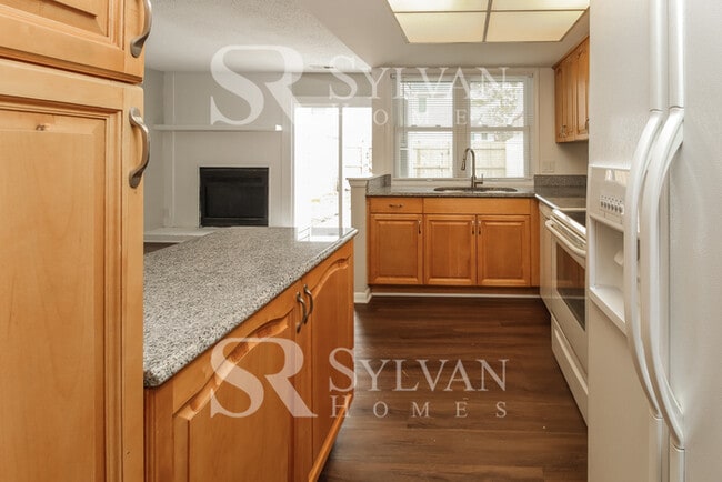 Building Photo - Welcome to this charming abode.