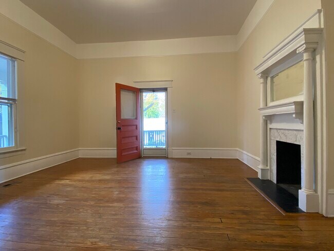 The handsome fireplaces in the living room and kitchen are decorative. - 218 Linden Ave
