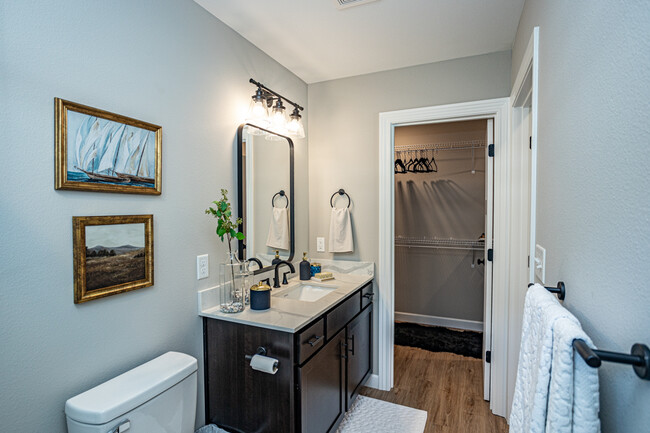 Primary bathroom featuring tile shower and luxury vanity - 110 Sierra Cir