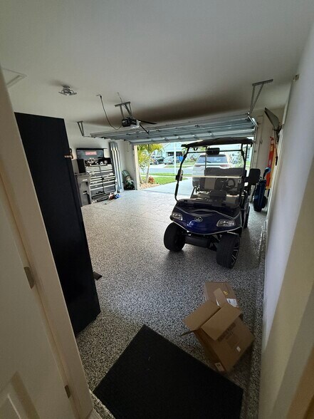 Garage with epoxy floor - 17014 Avon Dive Ln