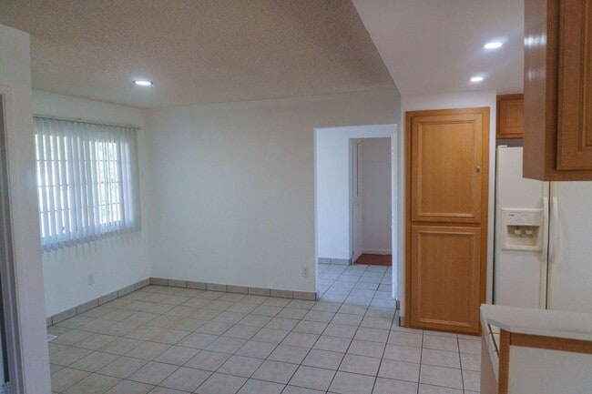 Building Photo - Spacious Three Bedroom, Two Bathroom House featuring Two Car Garage With Huge Yard