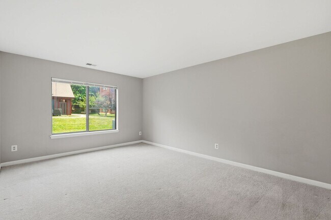 Building Photo - Contemporary design meets exceptional space in this inviting ground level residence, offering eff...