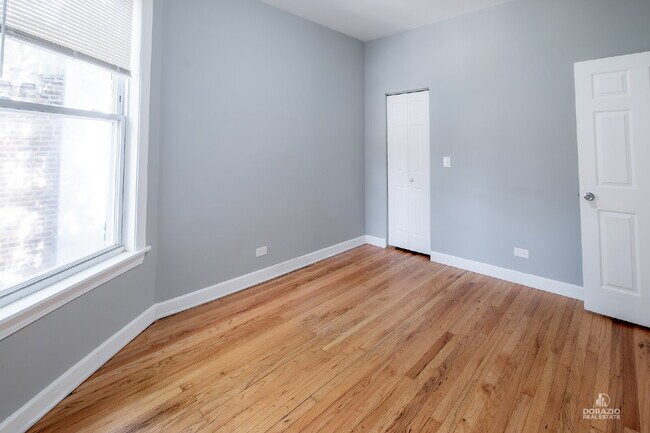 Building Photo - Modern 4BR Apartment with Hardwood Floors, Balcony & Central A/C