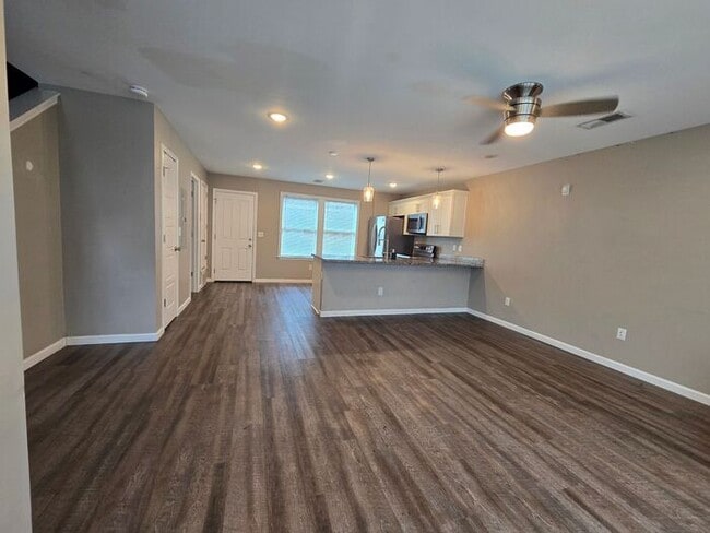 Building Photo - Live Steps from the Highland Strip — Share...