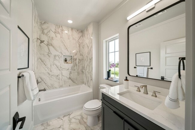 Building Photo - Discover modern elegance in the newly constructed Edgewater Condominiums, a boutique community fe...