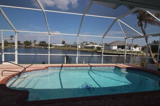Building Photo - Short Term Rental ** Available 6/1/26 ** 3 Bed/2 Bath Pool Home ** Punta Gorda Isles** $7,500/mo