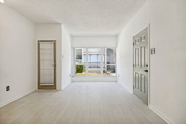 Building Photo - Spacious Dallas Condo with Unbeatable Storage, Private Patio & Carport