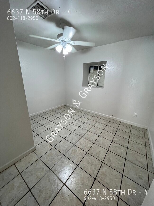 Building Photo - 6637 N 58th Dr