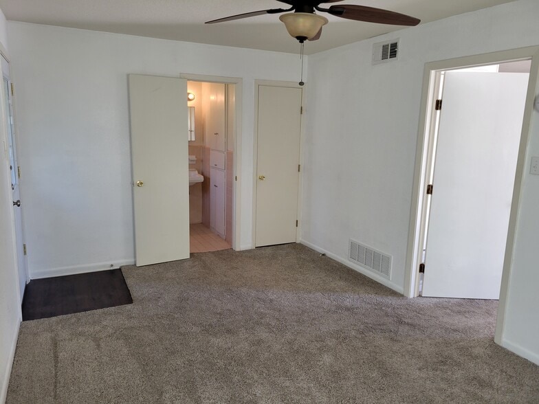 Bedroom toward closet - 1605 N W S Young Dr
