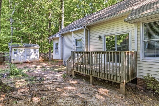 Building Photo - NW - Updated Home with Granite Counter-tops, Fire Place, Deck, Storage Building, Garage!