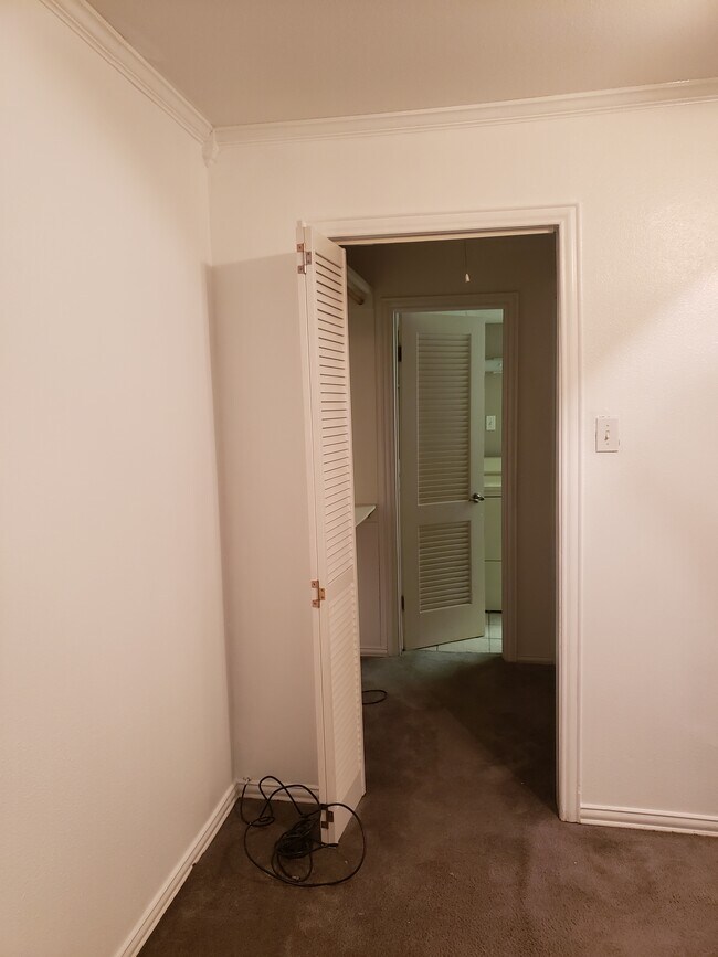 Bedroom walk in closet leads to utility room and bathroom - 500 E Avenue J