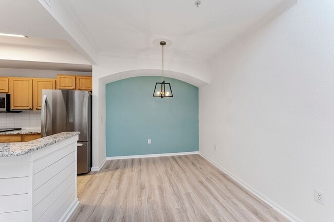 Building Photo - IMMACULATE 2nd Story condominium with so m...