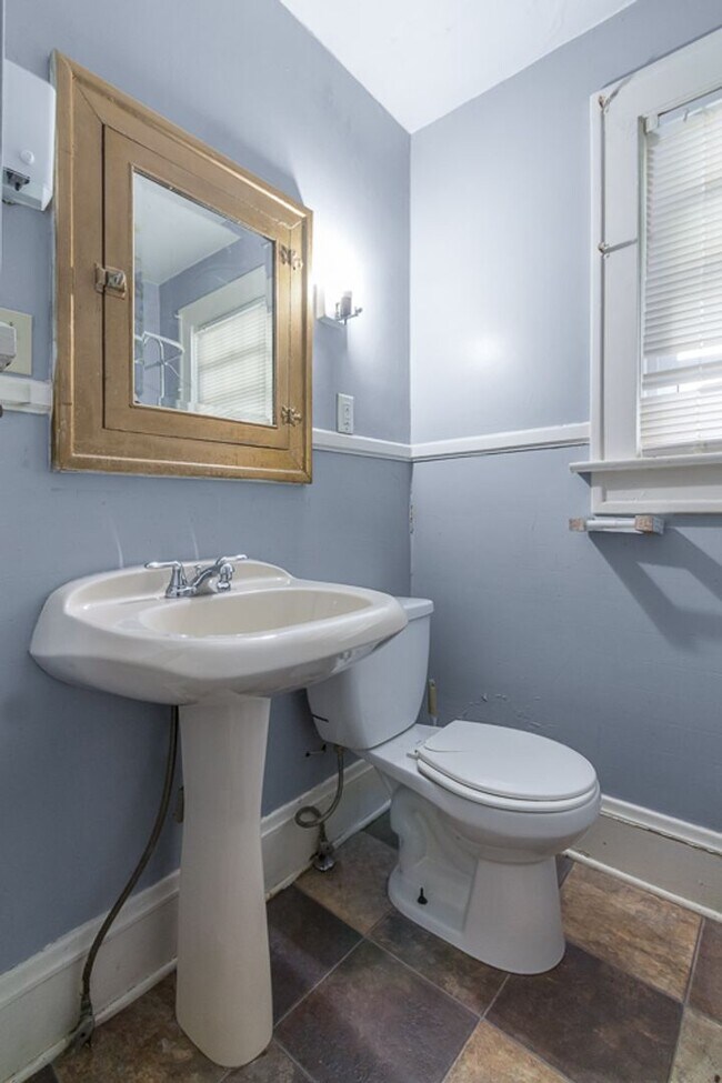 Building Photo - Charming 3BR Home with Classic Woodwork, Porch & Bonus Attic Space